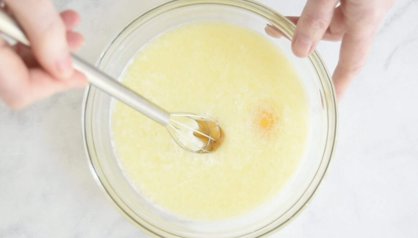 Whisking eggs into milk