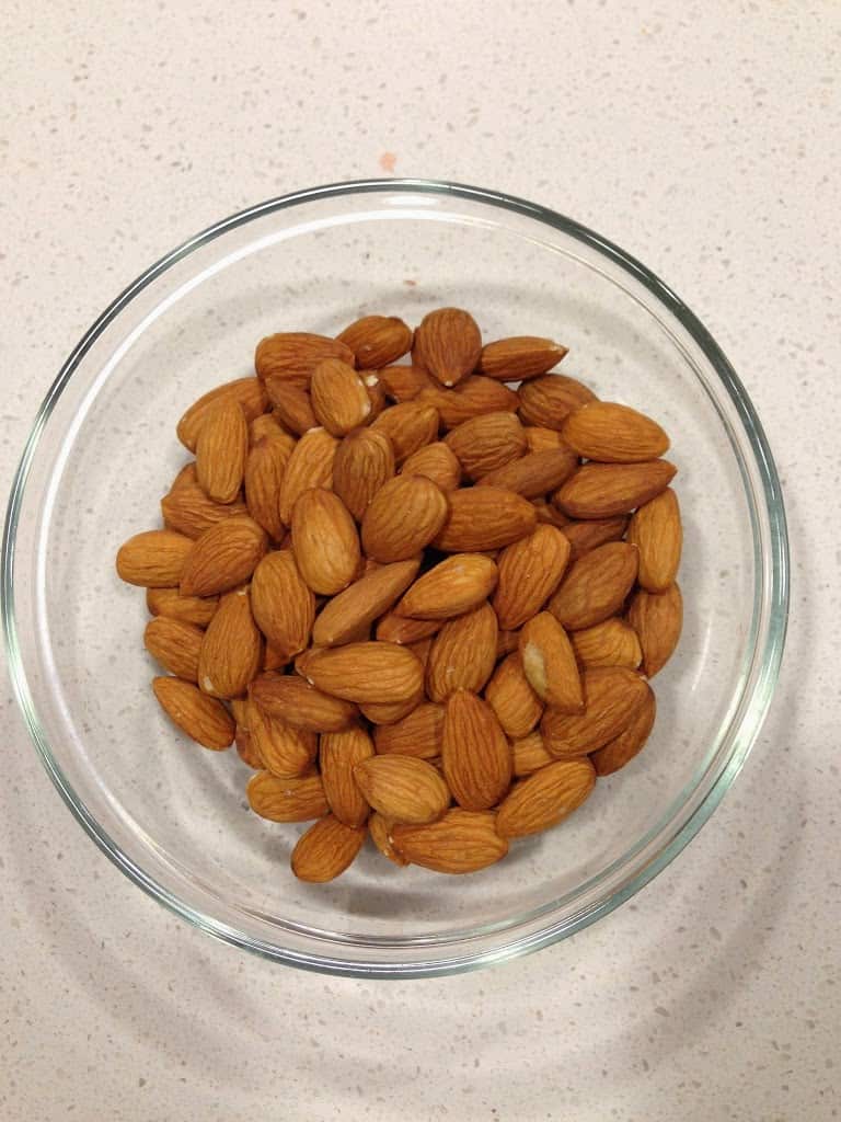 A glass bowl of almonds