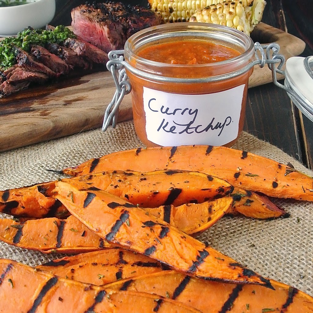 Grilled sweet potatoes with a jar of curry ketchup