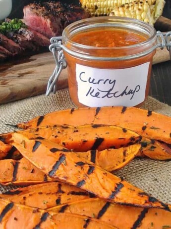 Grilled sweet potatoes with a jar of curry ketchup