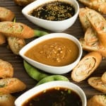 3 dipping sauces in decorative bowls