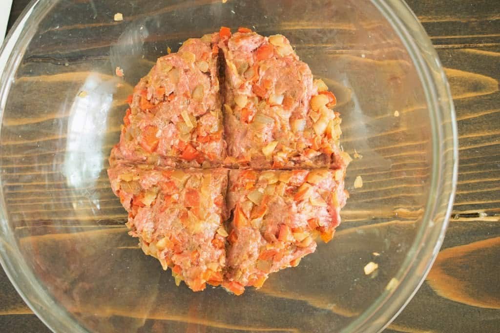 The burger meat in a bowl showing how to portion into 4