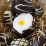 A chocolate Easter egg cut open to reveal marshmallow center