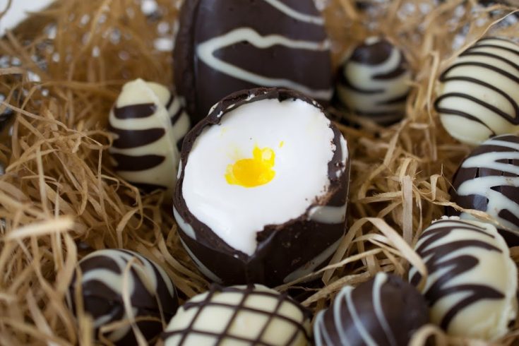 A chocolate Easter egg cut open to reveal marshmallow center
