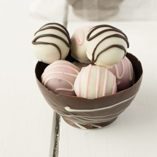 A closeup showing the truffles in the chocolate bowl
