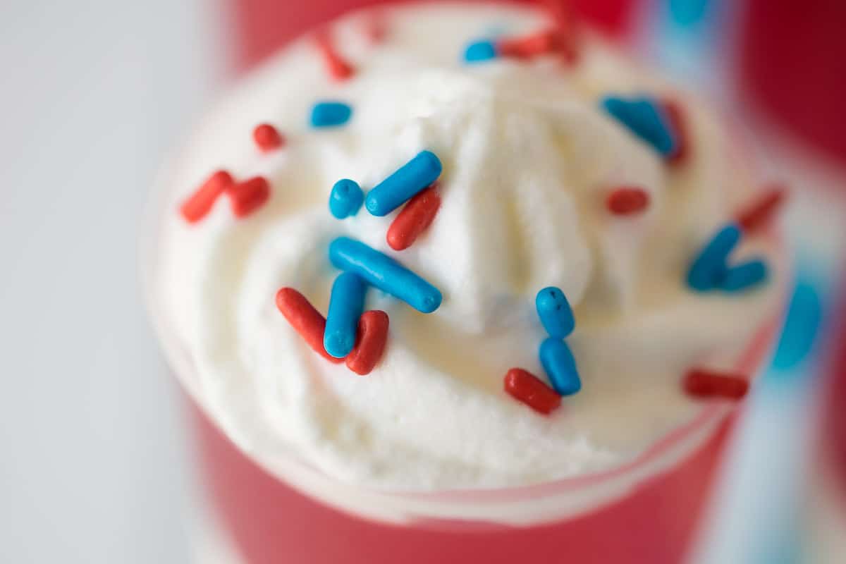 These Patriotic Jello and cream push pops are easy to make and so much fun to look at and eat! Get your kids involved in not only the eating, but the making of the layers of Jello, lemon cream and sprinkles. Fun for 4th July or Memorial Day celebrations.