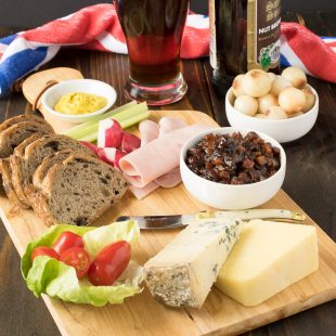 A very British and extremely popular pub lunch item, the Ploughman's lunch is a meal consisting of cold meats, cheese, bread, pickle and of course, beer. It's like a picnic on plate. This recipe, the fabled Ploughman's lunch, completes my British recipes week.