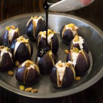 Warm figs with goat cheese, pistachios and balsamic glaze