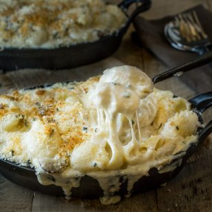 Mushroom, sage mac and cheese. Creamy, really creamy and gooey cheese sauce with a meaty bite from mushrooms, earthy flavor from fresh sage (for an essence of Fall) and a crunchy panko breadcrumb topping. It's comfort food taken to the next level.