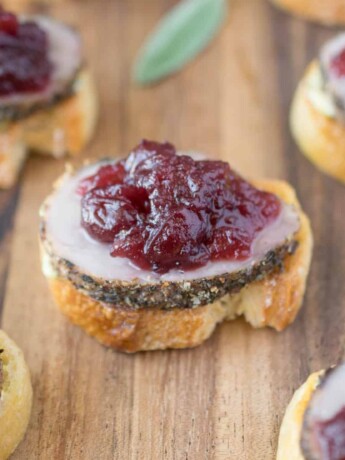 5 pork and cranberry crostini on a serving board