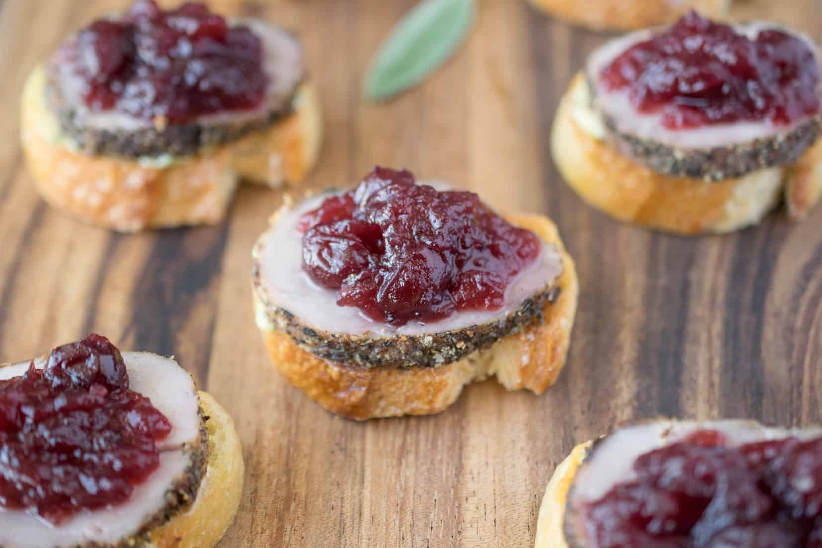 5 pork and cranberry crostini on a serving board