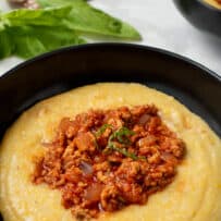 Smooth cheesy polenta with meaty sausage sauce
