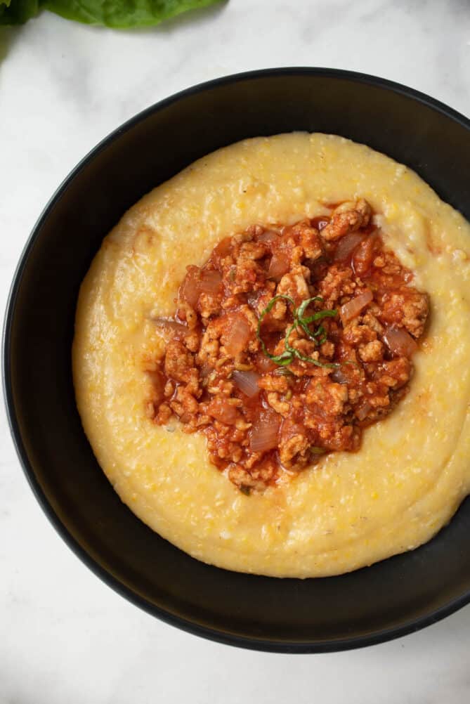 3 cheese polenta with Italian sausage viewed from overhead