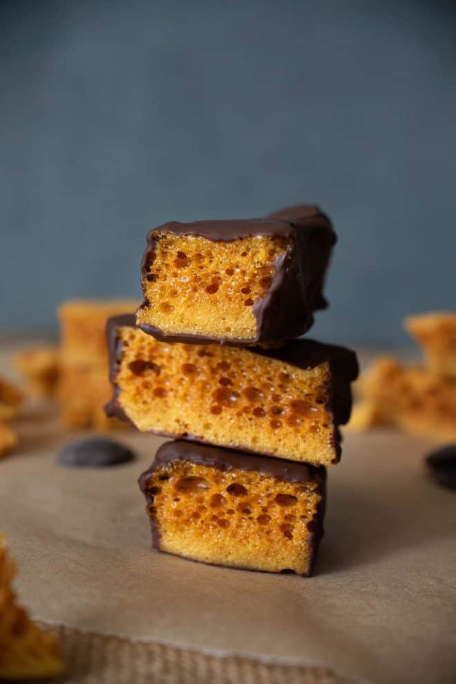 3 pieces of 3 Ingredient Cinder Honeycomb Toffee coated in chocolate