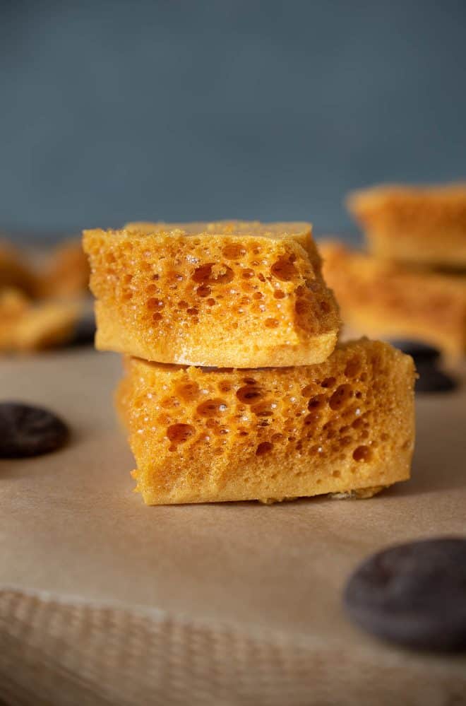 Cut pieces of 3 Ingredient Cinder Honeycomb Toffee showing the crispy holes