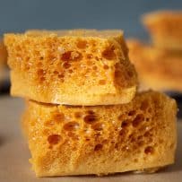 Golden and crispy cinder toffee showing the inside honeycomb pattern