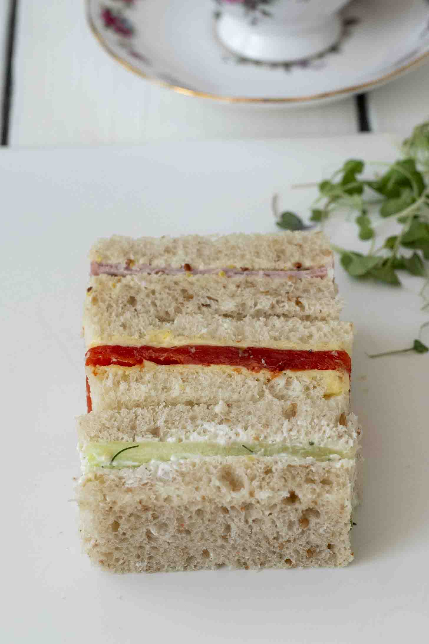 Ham, smoked salmon and cucumber tea sandwiches cut into rectangles