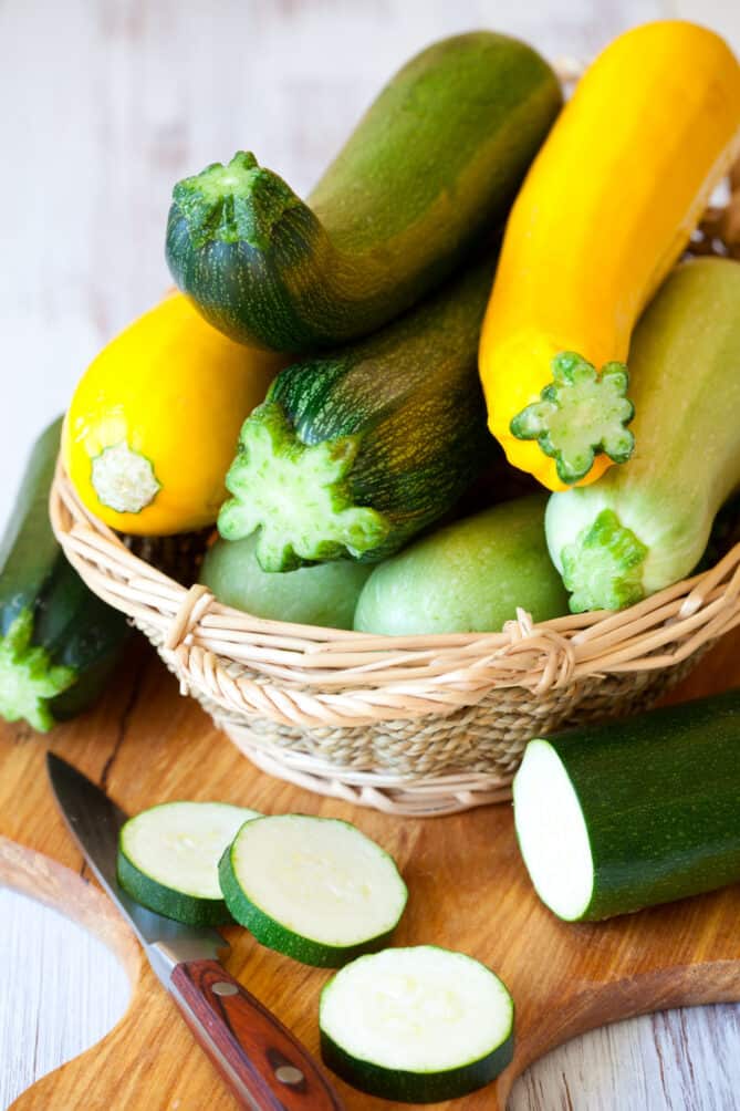 Green and yellow zucchini in a basket