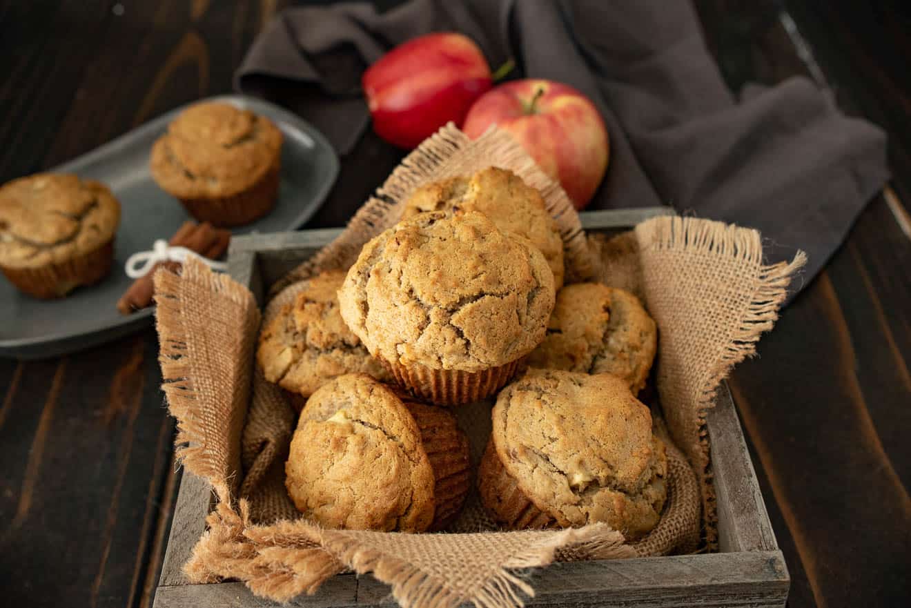 Apple pie pecan muffins in a burlap lined wood bowl