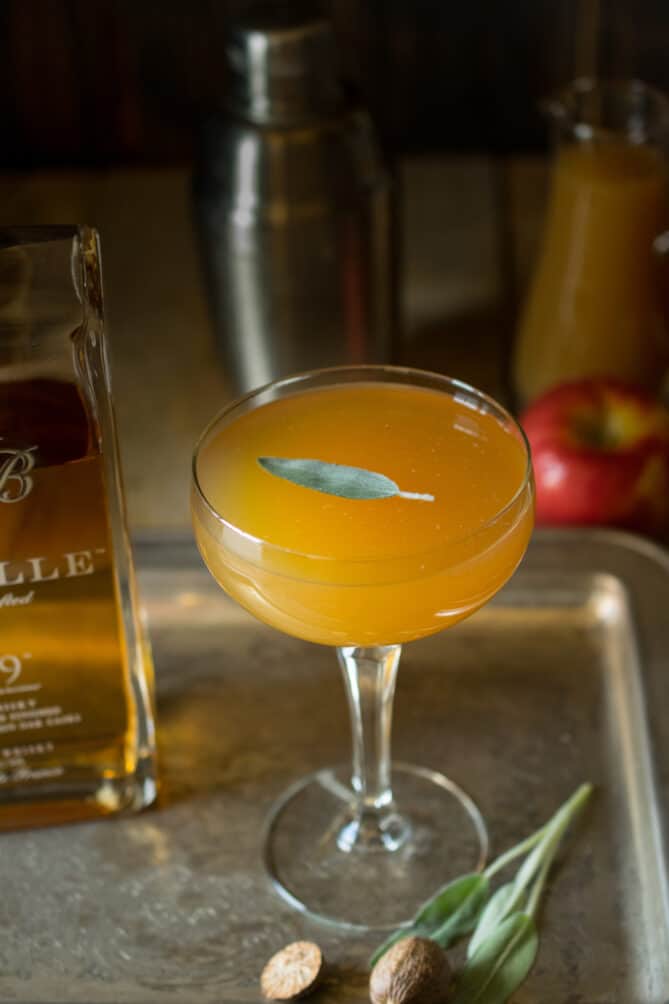 An elegant coupé glass with an apple cocktail