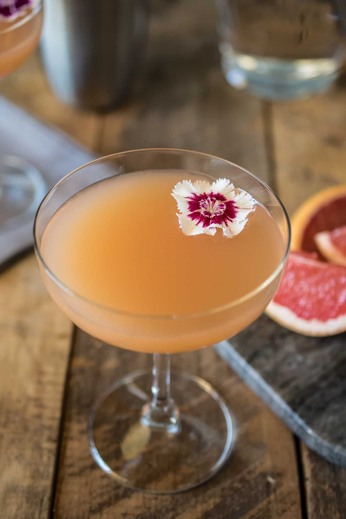 The drink from overhead showing the pretty red and white flower garnish