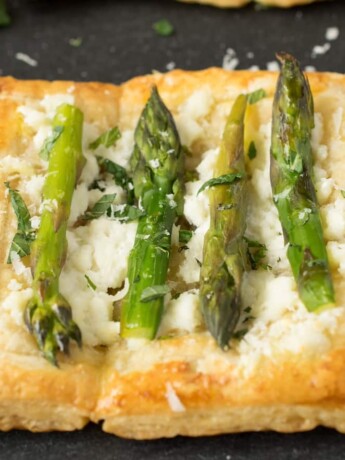 A closeup of a small asparagus tart