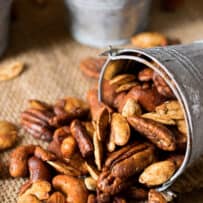 A medley mix of nuts that are roasted presented in buckets