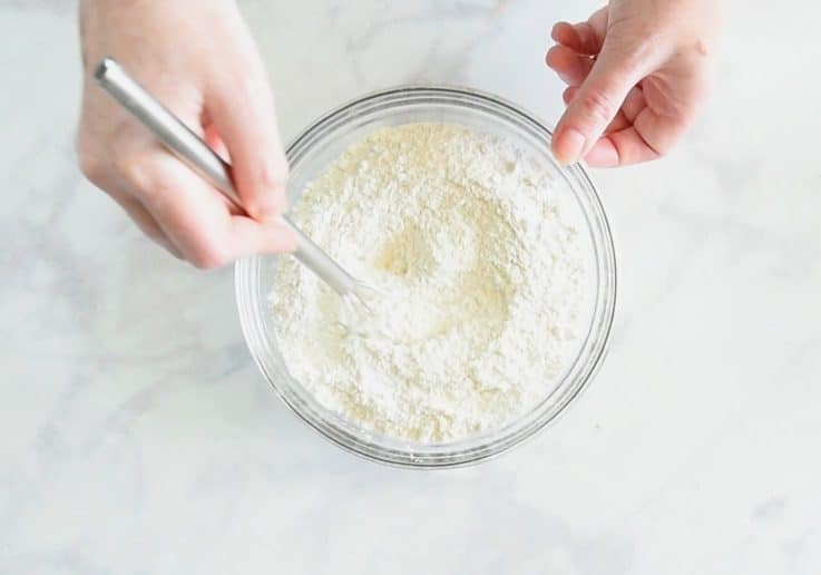 Flour, baking powder and salt mixed in a glass bowl