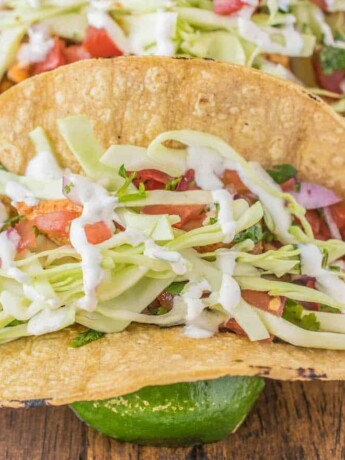 A corn tortilla filled with halibut, pico de gallo, cabbage and Mexican cream