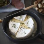Melted brie fondue in a dish with bread