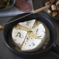 Melted brie fondue in a dish with bread