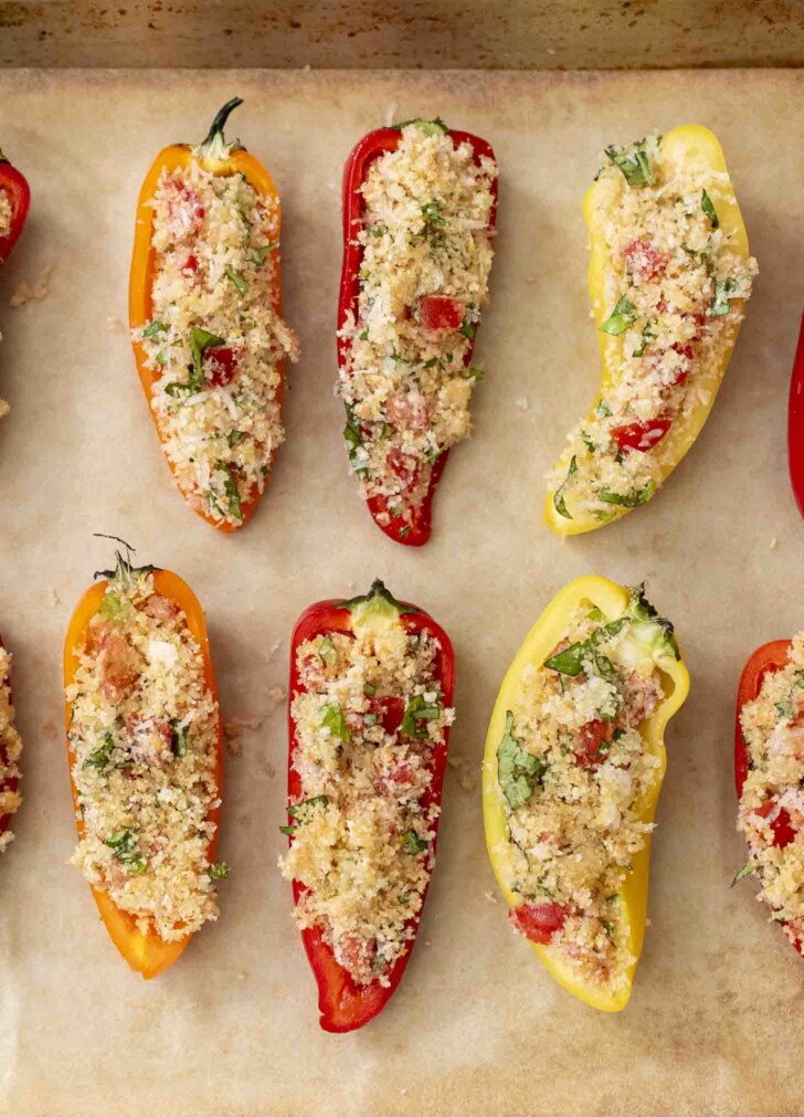 Long peppers filled with breadcrumbs, tomato, cheese and herbs