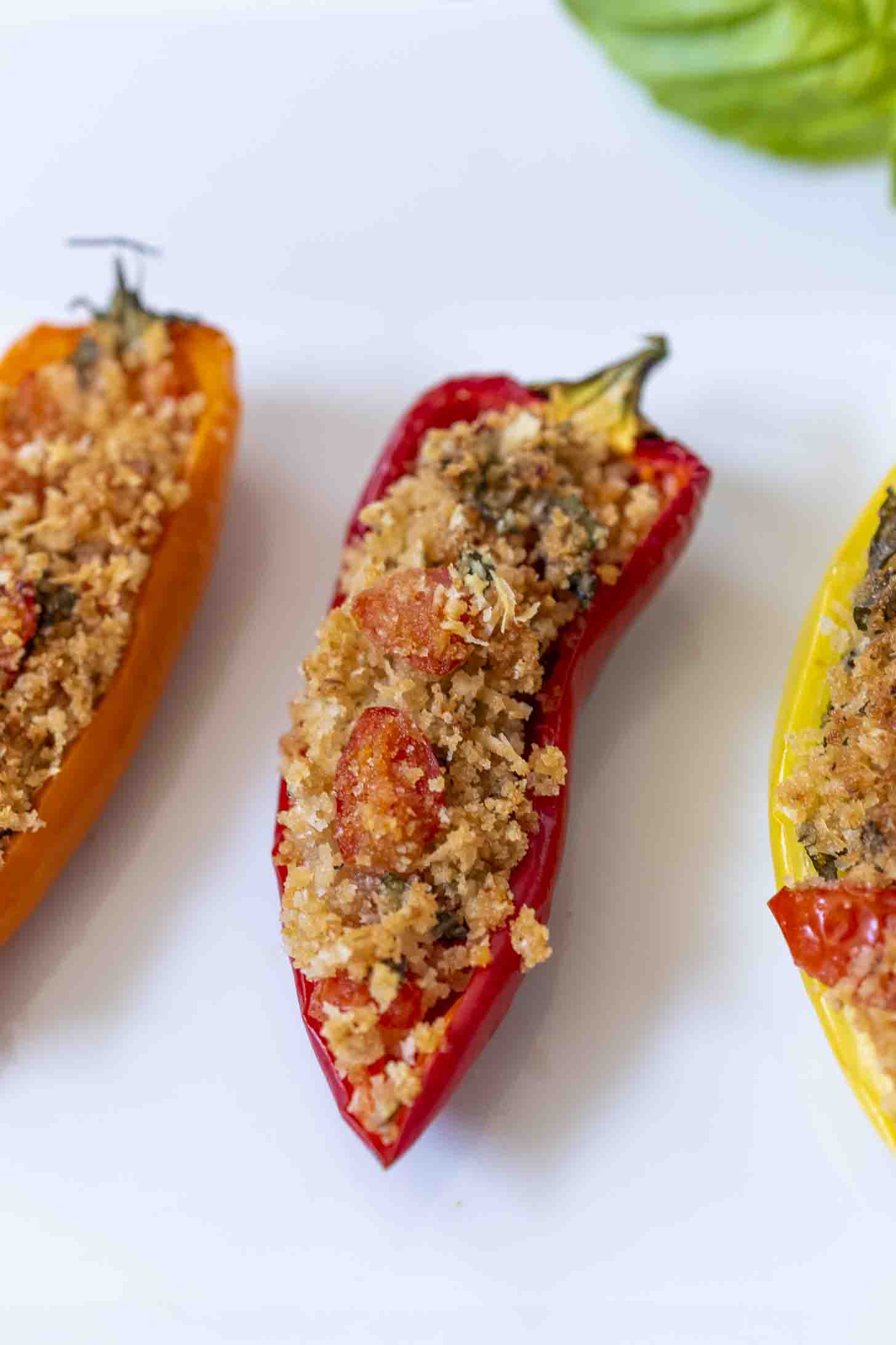 A closeup of a stuffed sliced red pepper