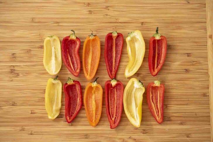 Colorful mini peppers cut in half