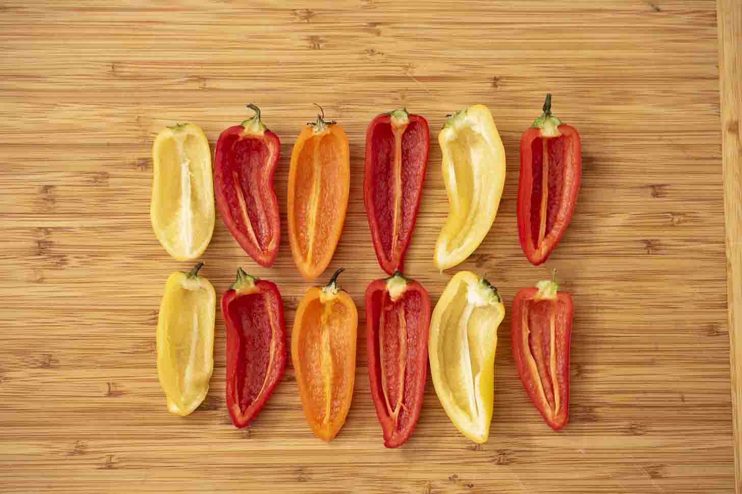 Colorful mini peppers cut in half
