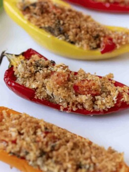 Breadcrumbs mixed with Parmesan, herbs and tomato in pepper halves and baked