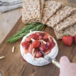 Cutting into the baked brie