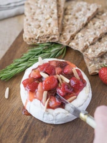 Cutting into the baked brie
