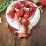 Baked brie with strawberries and rosemary is an easy and impressive dish to serve when entertaining. Creamy brie pairs perfectly with sweet strawberries and fresh rosemary served on top of a delicious, crunchy multigrain crispbread. What is better than warm melted cheese?