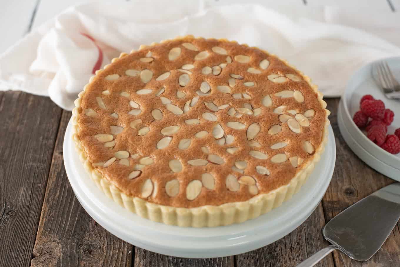 A bakewell tart topped with sliced almonds