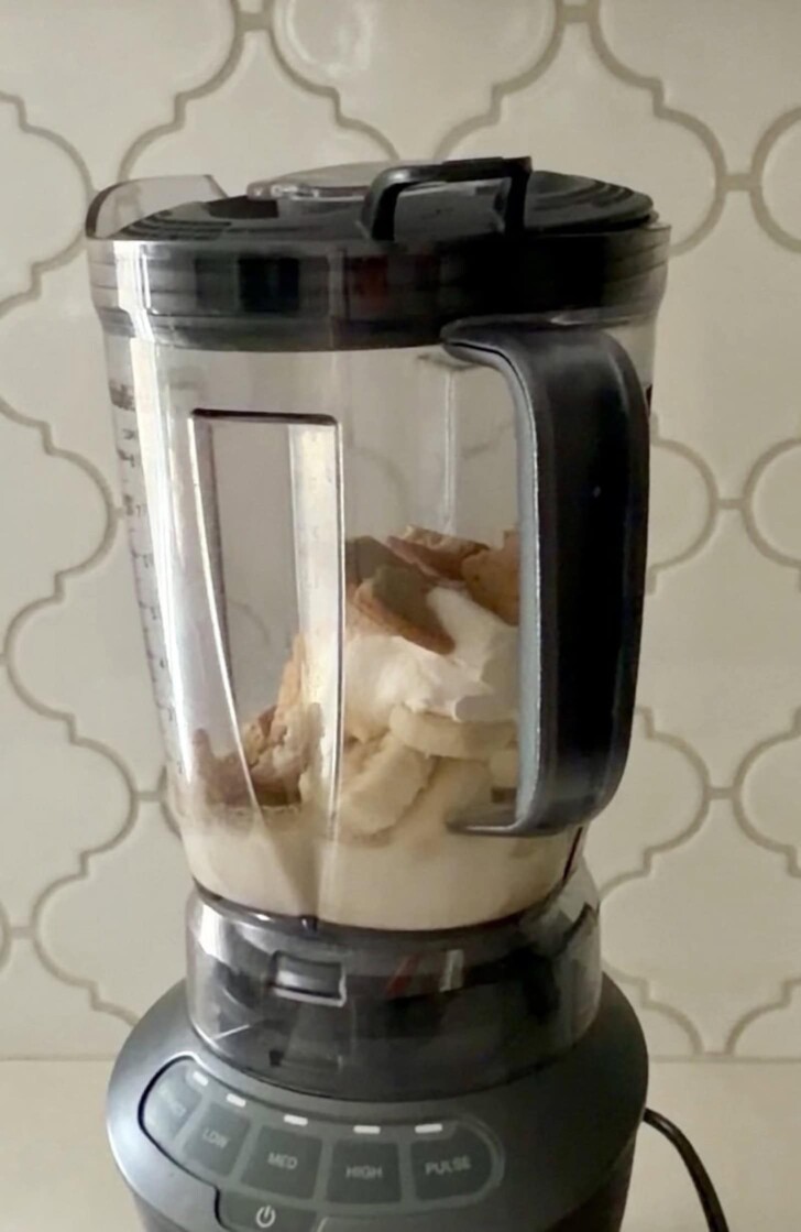 Ingredients for a banoffee pie milkshake in a blender