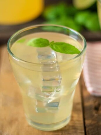 A short glass of basil ginger lime tea