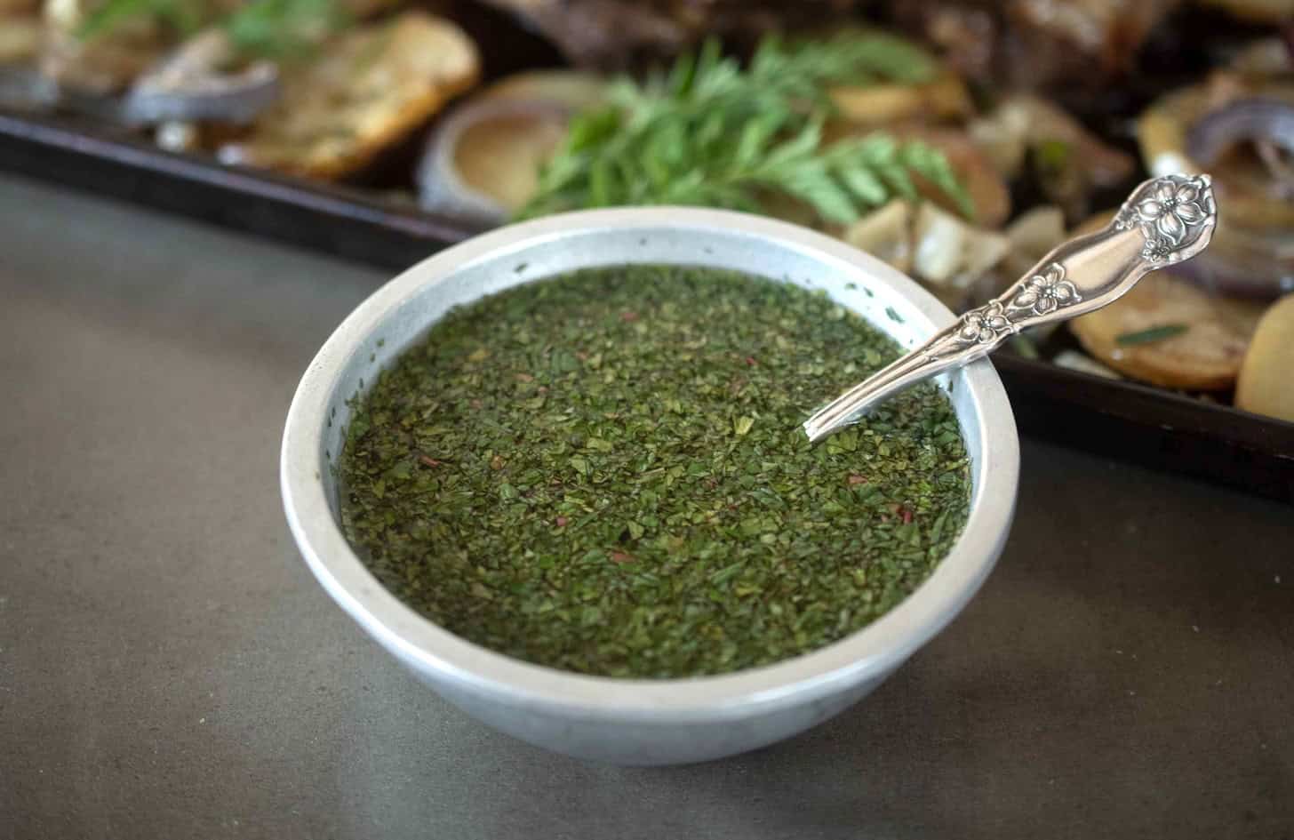 A silver bowl of mint sauce