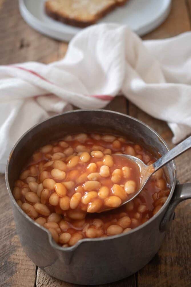 Baked beans on a large spoon