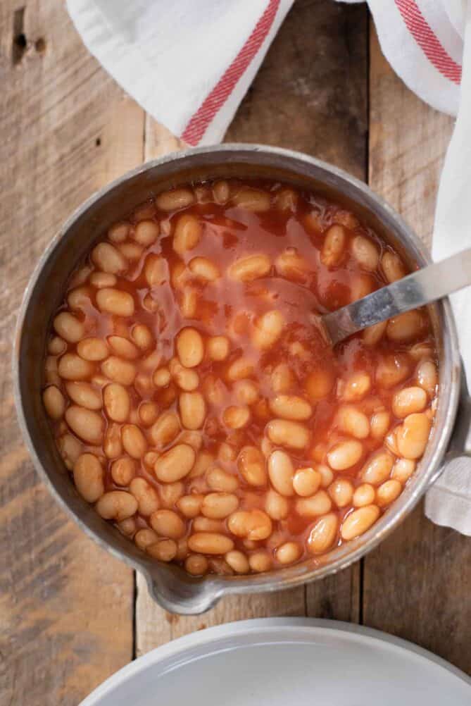 A pan full of baked beans in a tomato sauce
