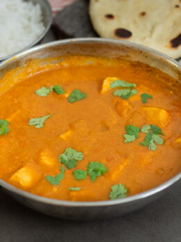 A chicken balti curry topped with cilantro/coriander