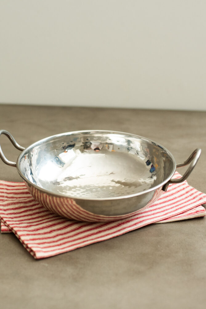 A silver Balti pan/bowl
