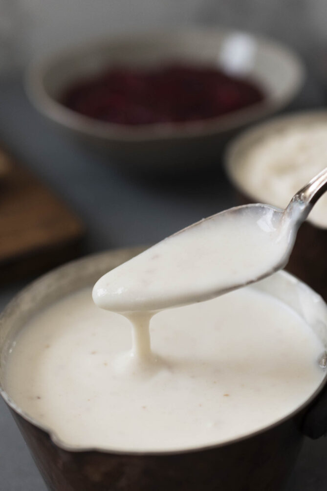 A spoonful of creamy smooth bread sauce