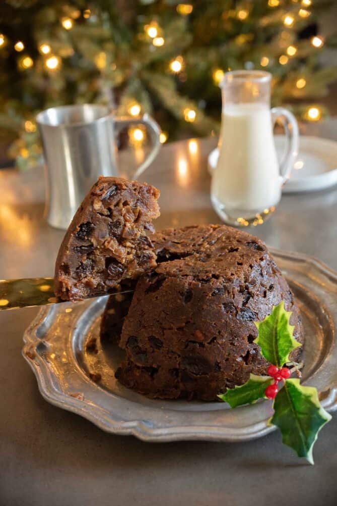 Cutting a slice of Christmas pudding