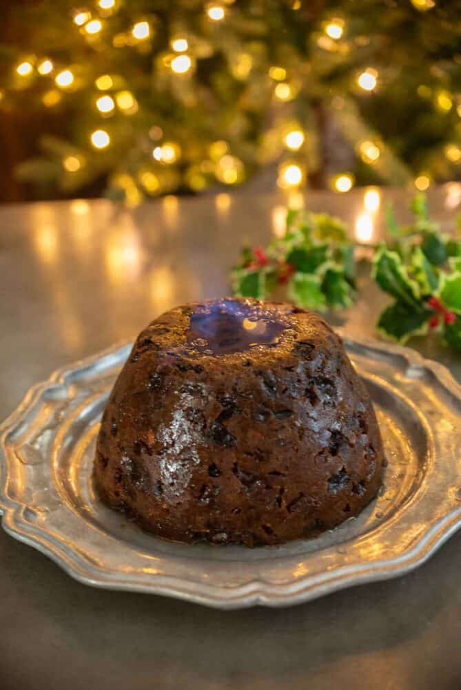 A Christmas pudding soaked in brandy and ignited